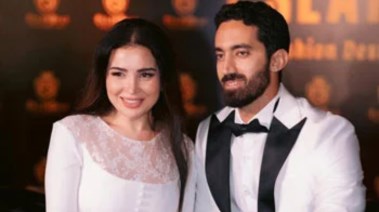 مي عز الدين وزوجها