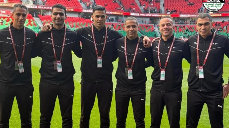 أمين عمر وطاقم والتحكيم