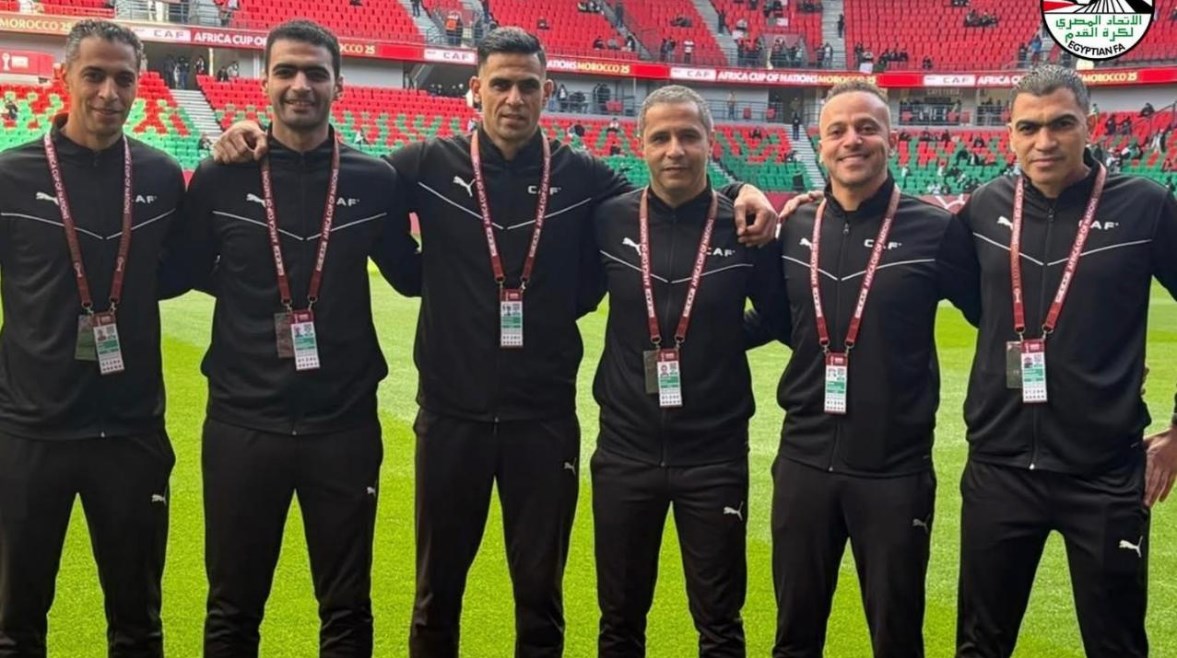 أمين عمر وطاقم والتحكيم