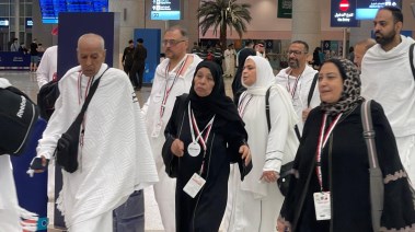 أسر شهداء الشرطة بعد وصولهم الأراضي المقدسة