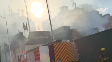 جانب من حريق واجهة قسم شرطة الأزبكية