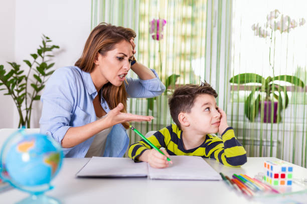 mother-becoming-frustrated-with-son-whilst-doing-h